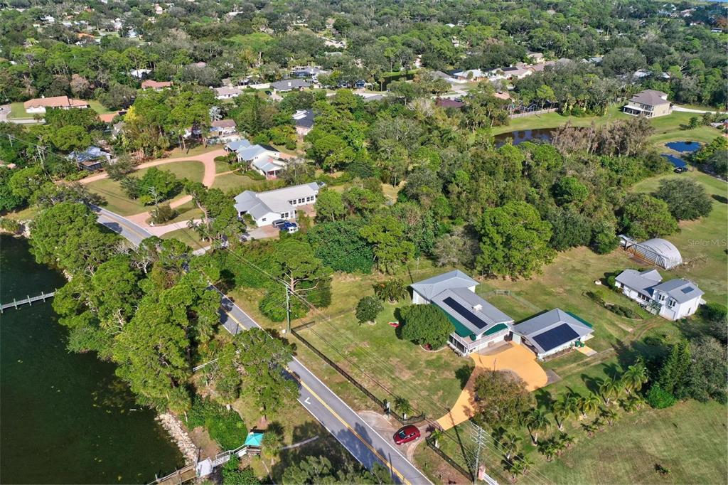0 South Tropical Trail Merritt Island, FL 32952 - Photo 42 of 46 an aerial view of residential house with outdoor space and trees all around