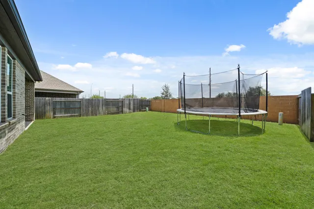 an aerial view of a house with swimming pool