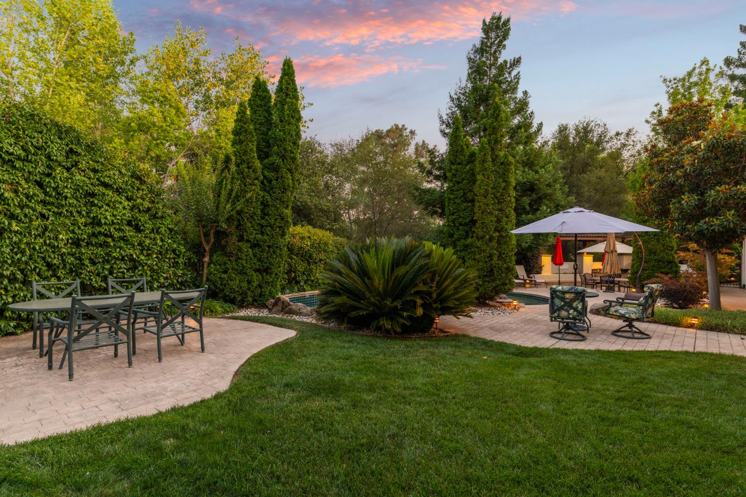 5869 Granite Hills Drive South Granite Bay, CA 95746 - Photo 46 of 66 a view of a table and chairs under an umbrella