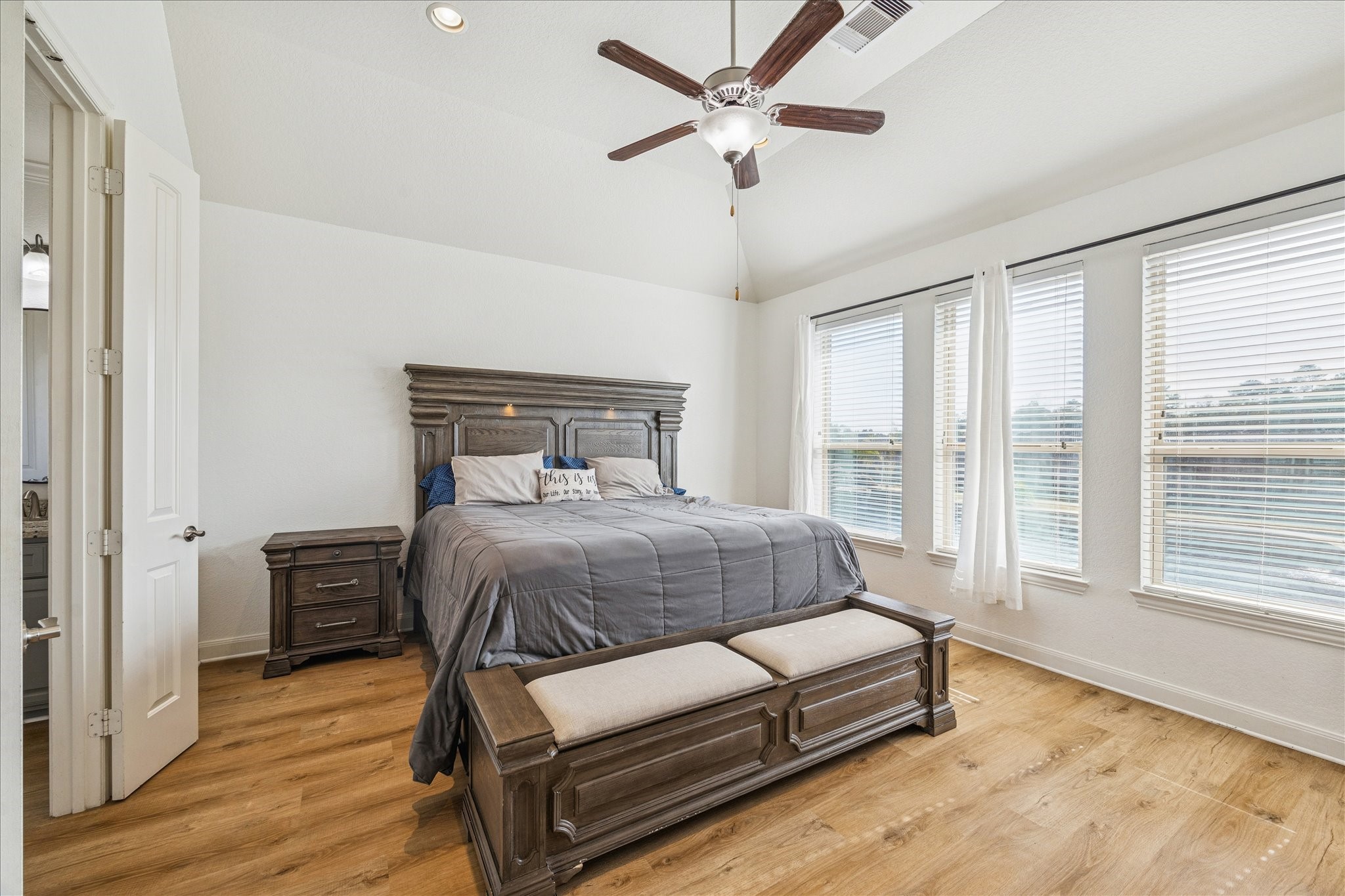 17903 Rushing Hollow Court Tomball, TX 77377 - Photo 17 of 34 a bedroom with a bed wooden floor and window