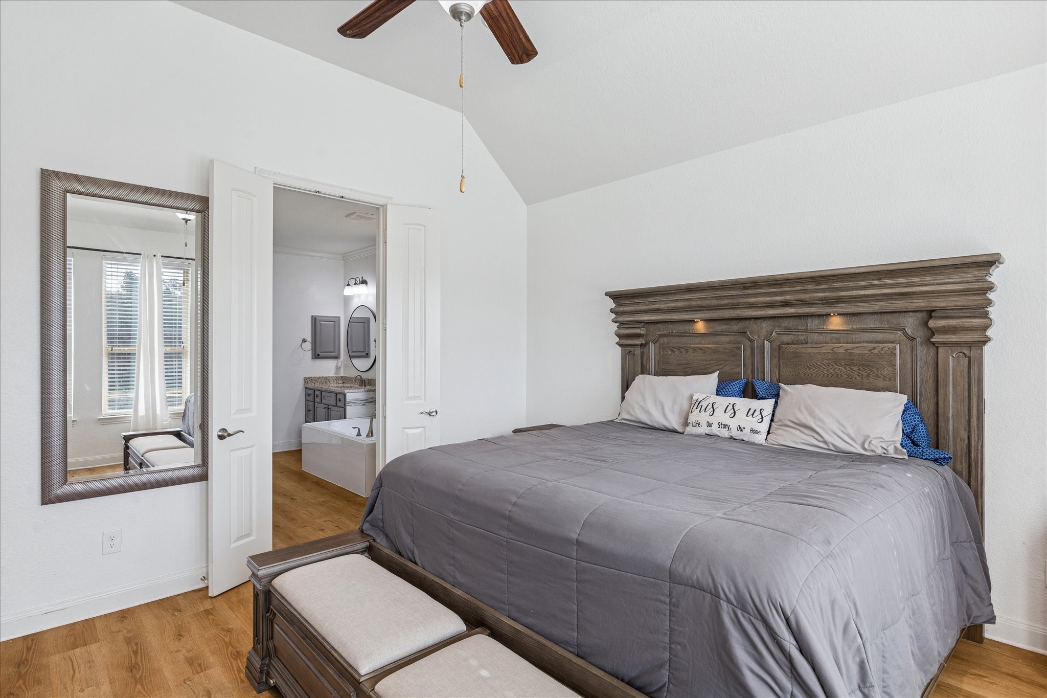 17903 Rushing Hollow Court Tomball, TX 77377 - Photo 18 of 34 a bedroom with a bed and wooden floor