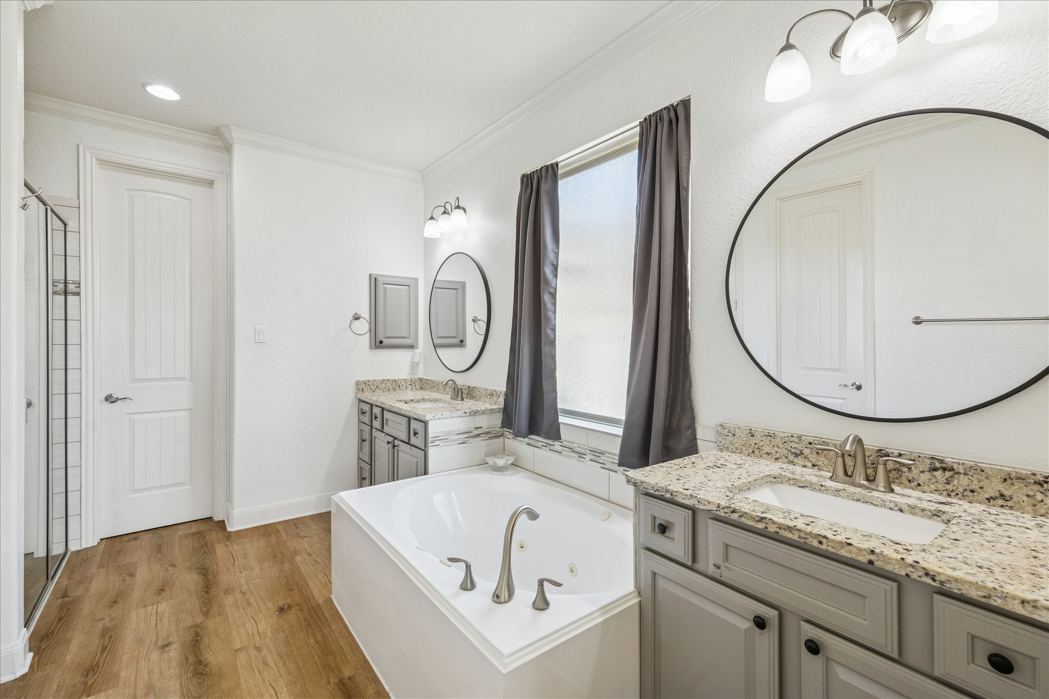 17903 Rushing Hollow Court Tomball, TX 77377 - Photo 19 of 34 a bathroom with a sink and a mirror
