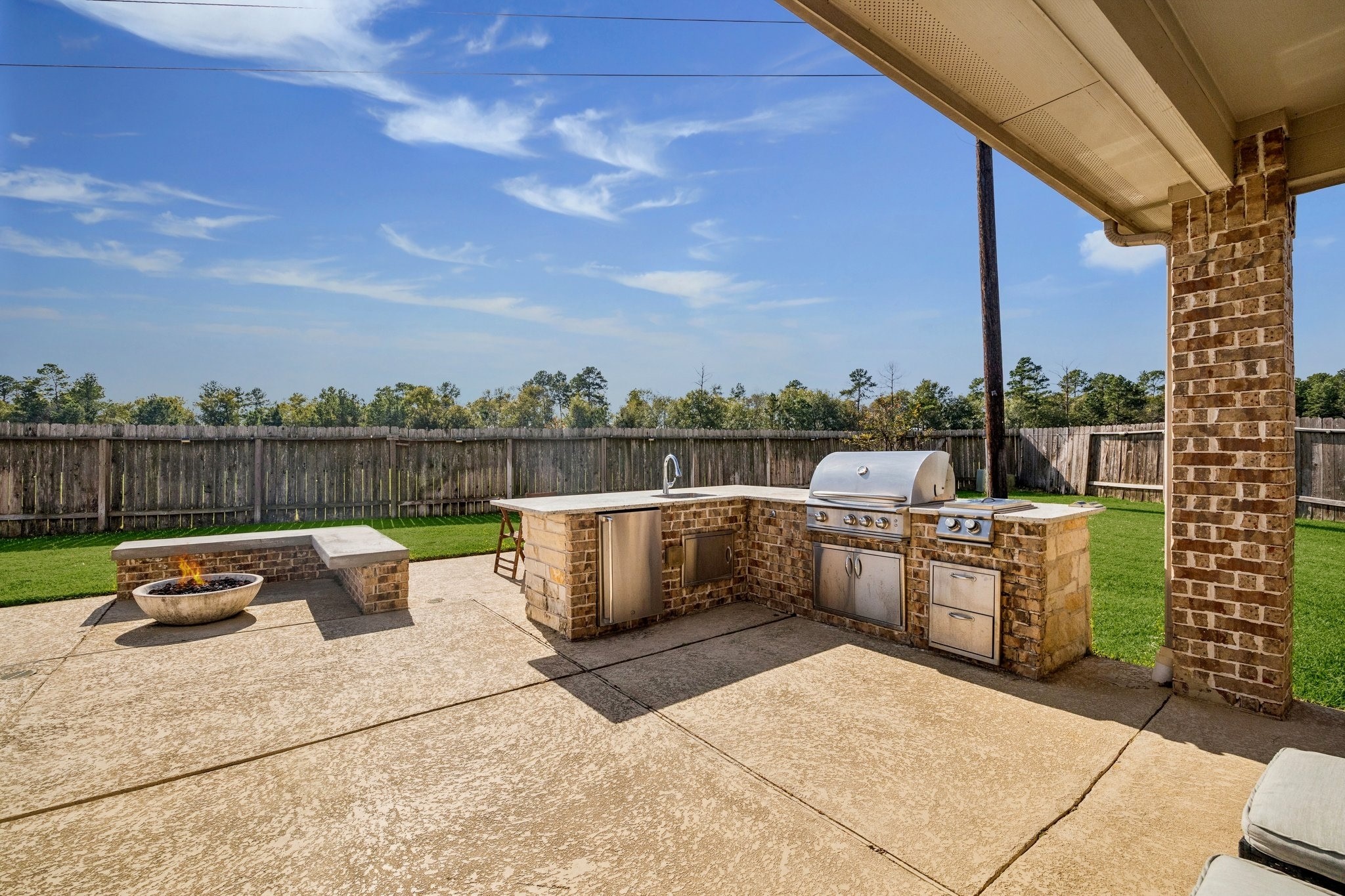 17903 Rushing Hollow Court Tomball, TX 77377 - Photo 20 of 34 a terrace with outdoor seating and barbeque oven