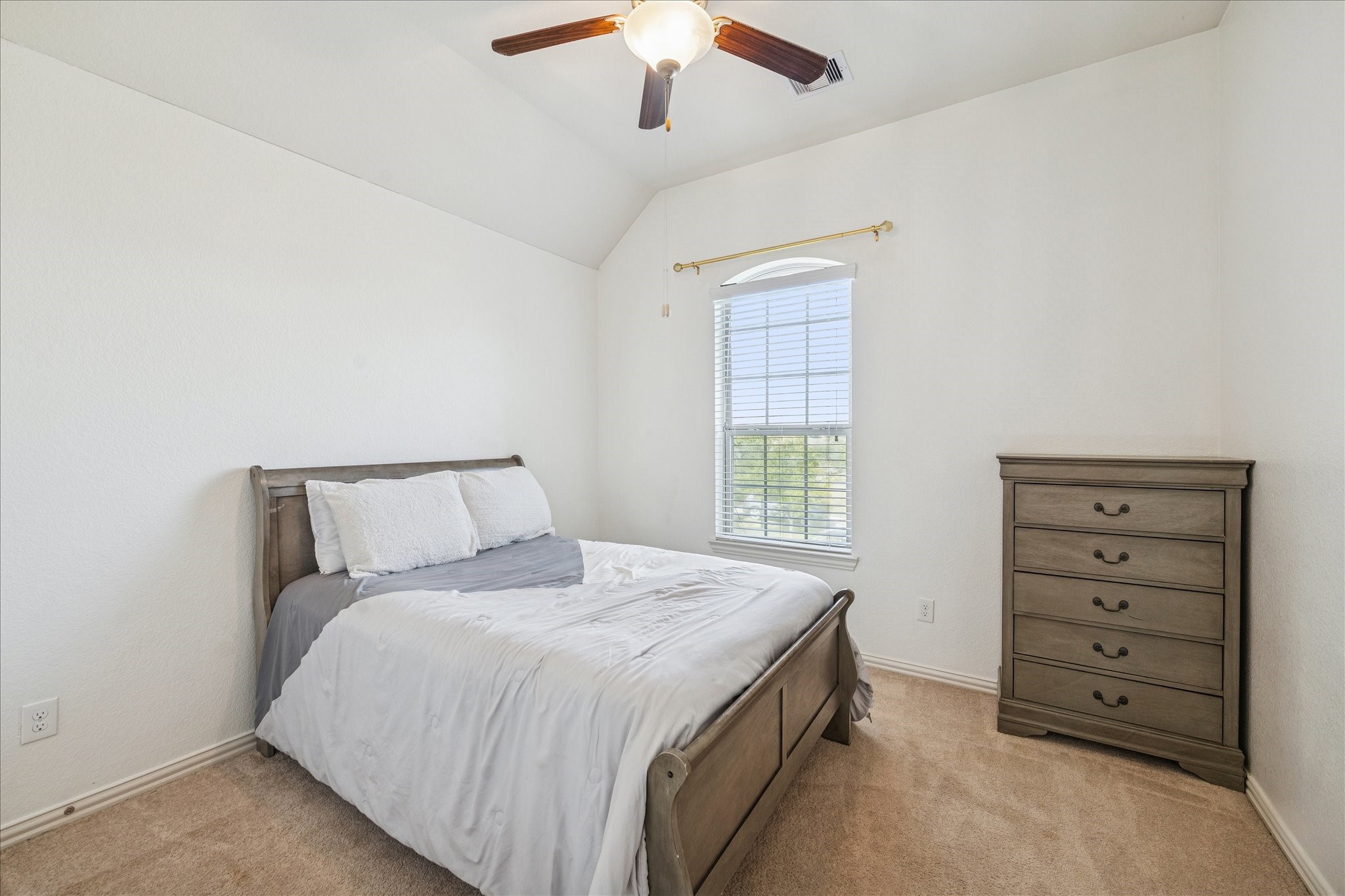 17903 Rushing Hollow Court Tomball, TX 77377 - Photo 26 of 34 a bedroom with a bed and a ceiling fan