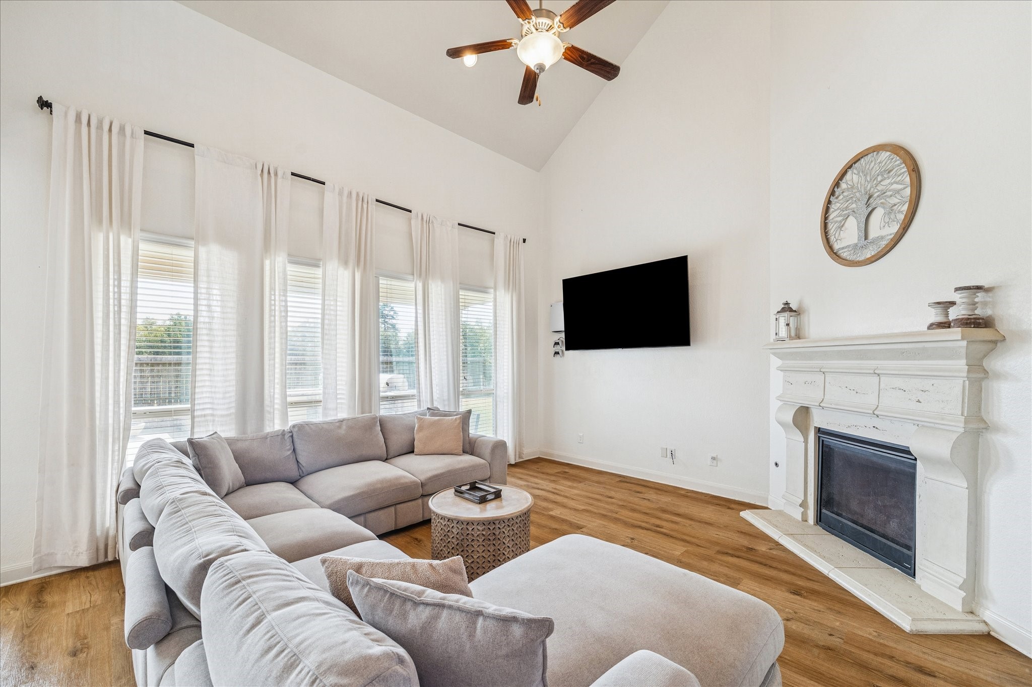 17903 Rushing Hollow Court Tomball, TX 77377 - Photo 3 of 34 a living room with furniture a fireplace and a flat screen tv
