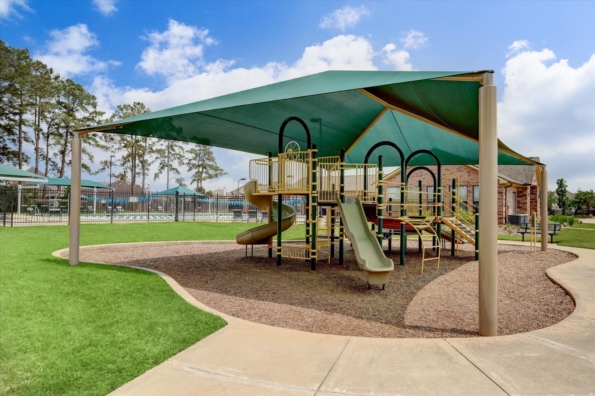 17903 Rushing Hollow Court Tomball, TX 77377 - Photo 34 of 34 a childrens park with lots of swings and slides