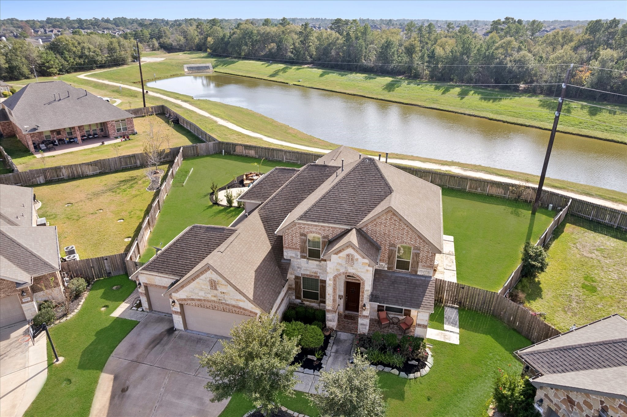 17903 Rushing Hollow Court Tomball, TX 77377 - Photo 5 of 34 an aerial view of a house with a lake view