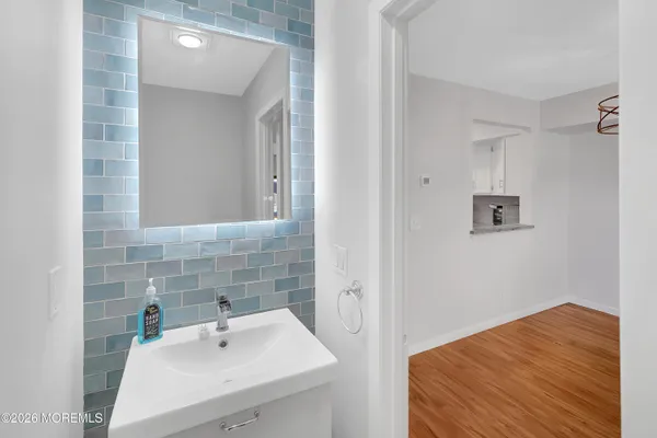 a bathroom with a sink and a mirror