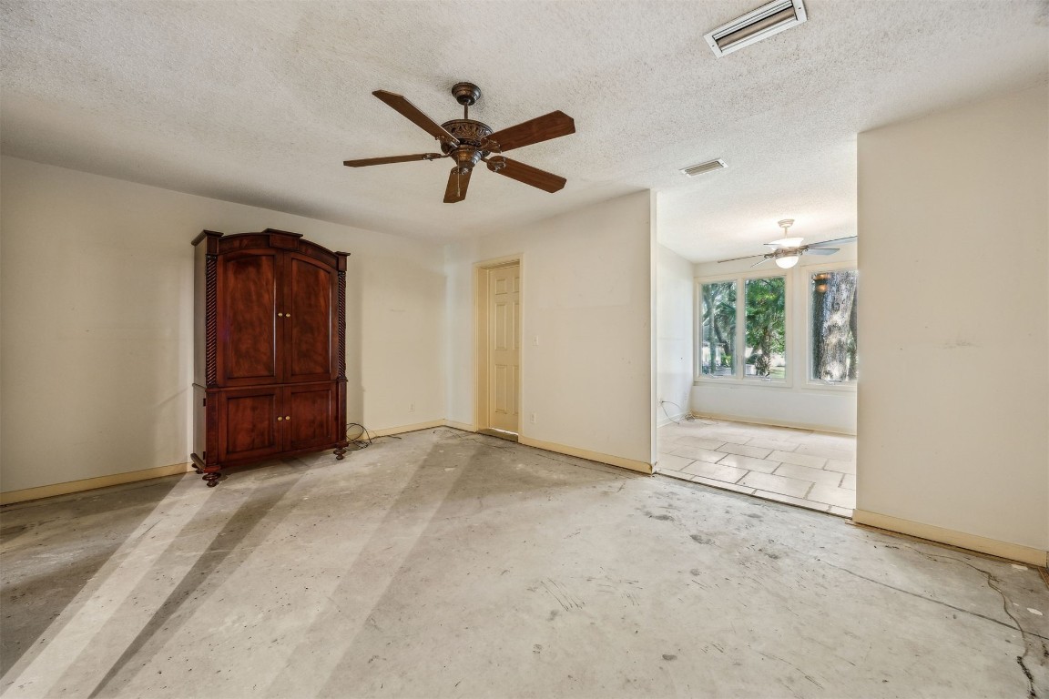 3316 Sea Marsh Road, Unit 3316 Fernandina Beach, FL 32034 - Photo 12 of 38 a view of a livingroom with a ceiling fan and window