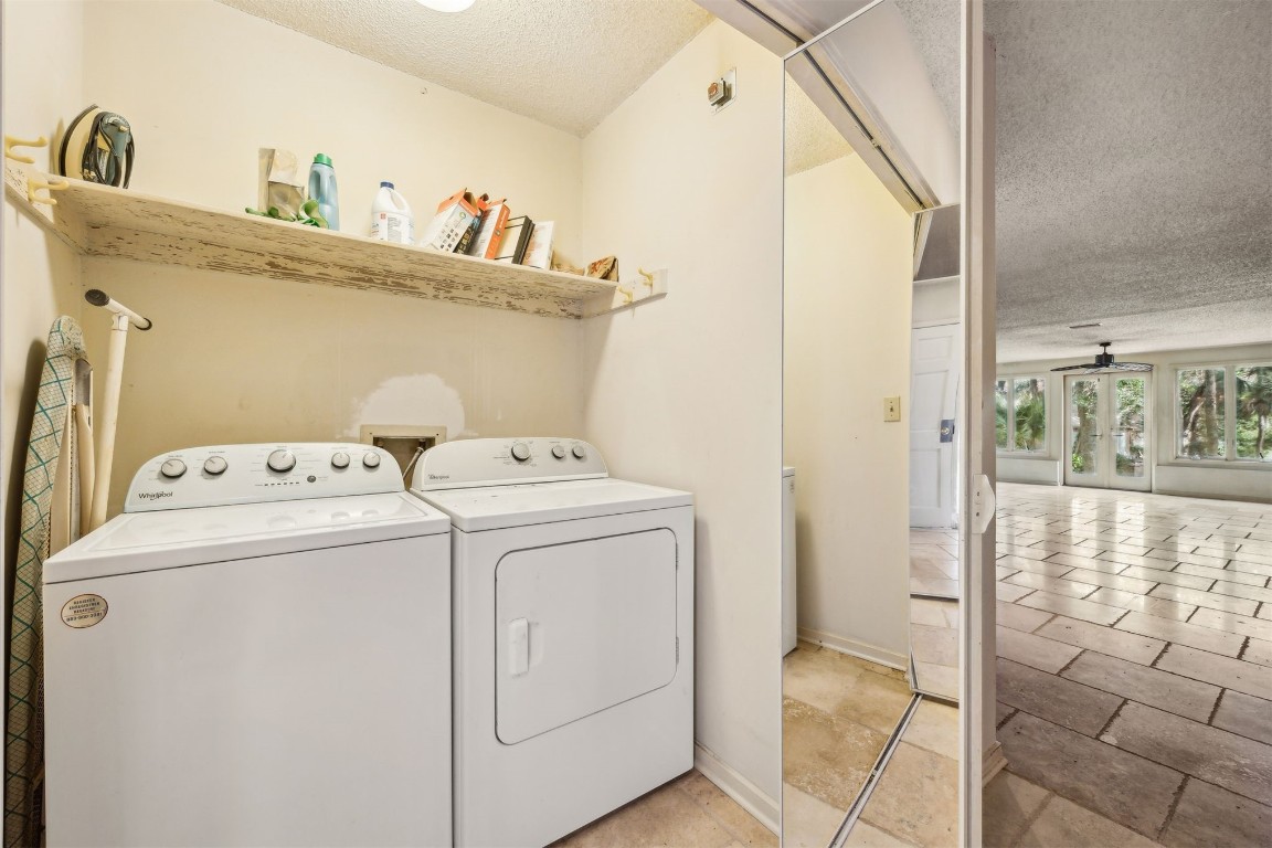 3316 Sea Marsh Road, Unit 3316 Fernandina Beach, FL 32034 - Photo 19 of 38 a utility room with dryer and washer