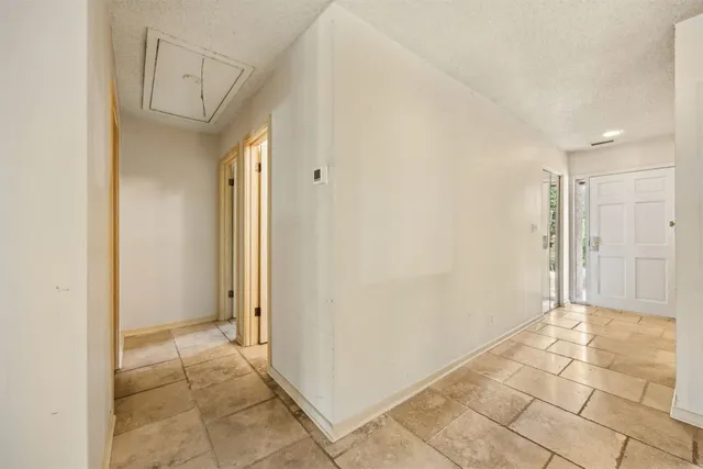 a view of an empty room with windows