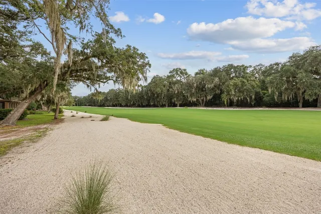 a view of a lake with a house in the background