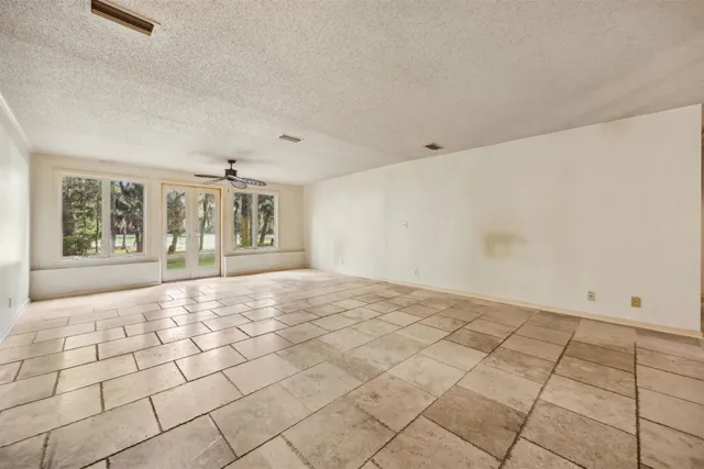 a kitchen with granite countertop cabinets and window