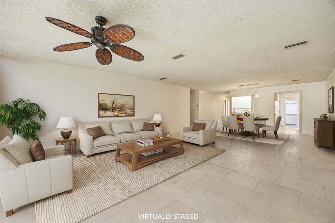 3316 Sea Marsh Road, Unit 3316 Fernandina Beach, FL 32034 - Photo 5 of 38 a living room with furniture and a ceiling fan