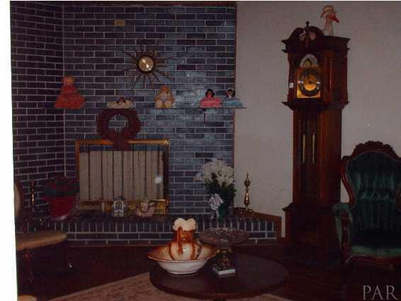 825 McKenzie Road Cantonment, FL 32533 - Photo 4 of 21 Two fireplaces - brick one in den and one in living room. Hardwood floors in living room others are covered with carpet and vinyl.