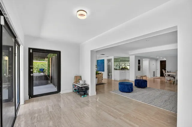 a bedroom with a bed and a dresser in it