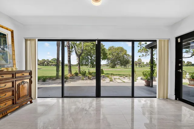 a bathroom with a sink a toilet a mirror a vanity and shower