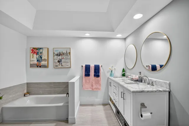 a front view of a house with garden and sitting area