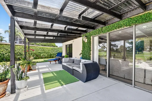 a view of hallway with furniture and wooden floor