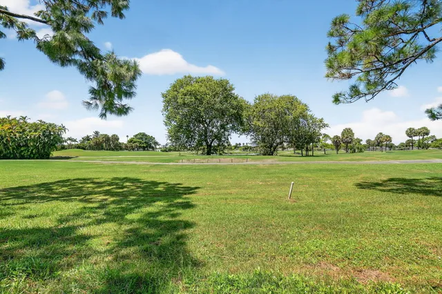 a bird view of multi story residential apartment building with yard
