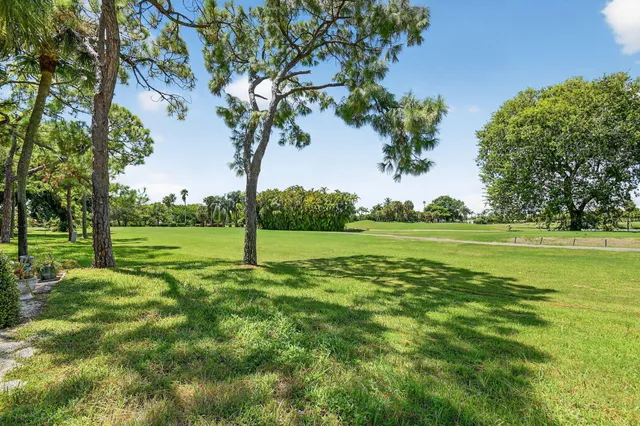 a view of a patio with a dining table and chairs