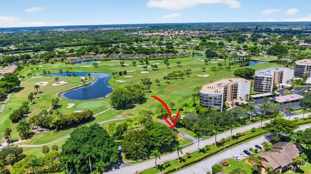 a view of a lake with houses in the background