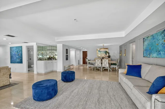 a view of living room with furniture and large window