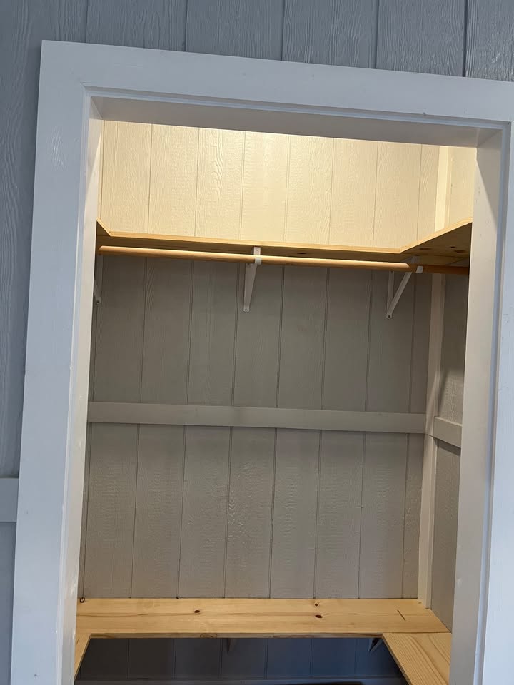 3505 Lone Man Mountain Road, Unit A Wimberley, TX 78676 - Photo 11 of 11 A well-organized closet with ample storage solutions and warm lighting.
