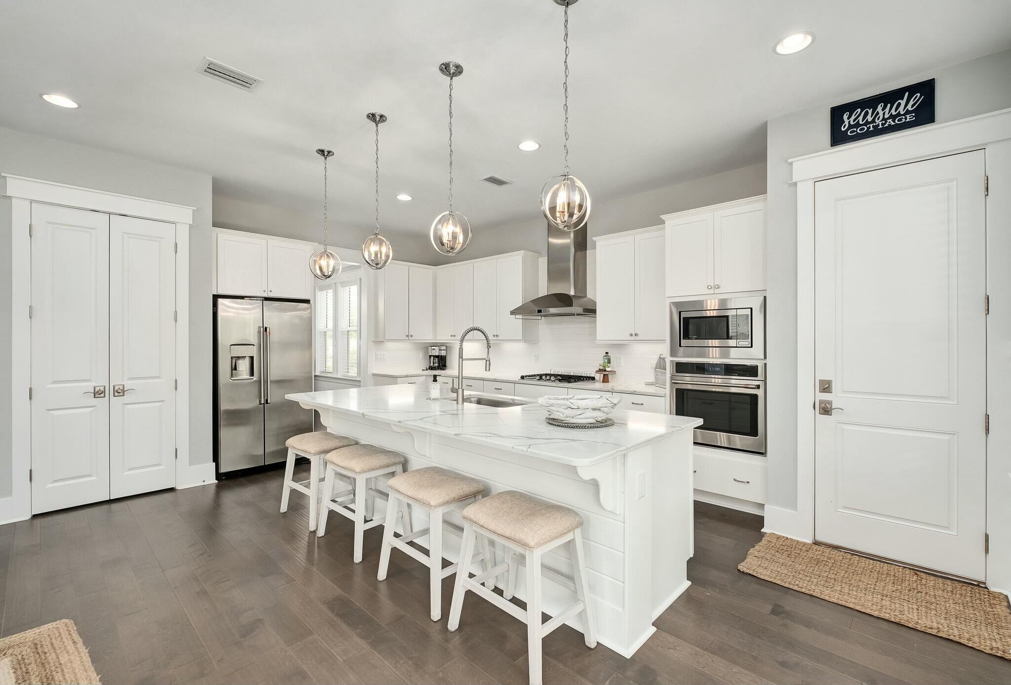 116 Prairie Pass Santa Rosa Beach, FL 32459 - Photo 11 of 59 a large kitchen with a table and chairs