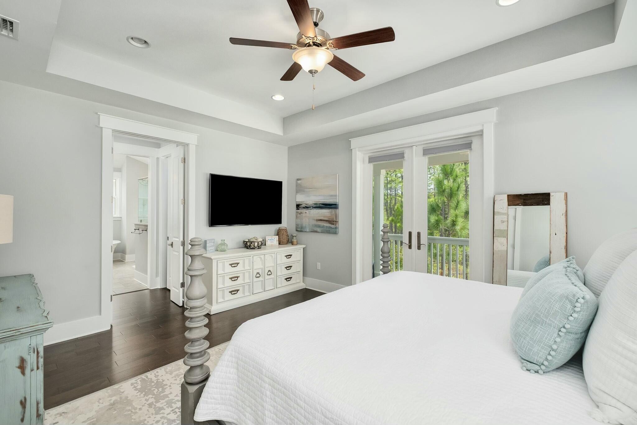 116 Prairie Pass Santa Rosa Beach, FL 32459 - Photo 16 of 59 a bedroom with a flat screen tv and a bed