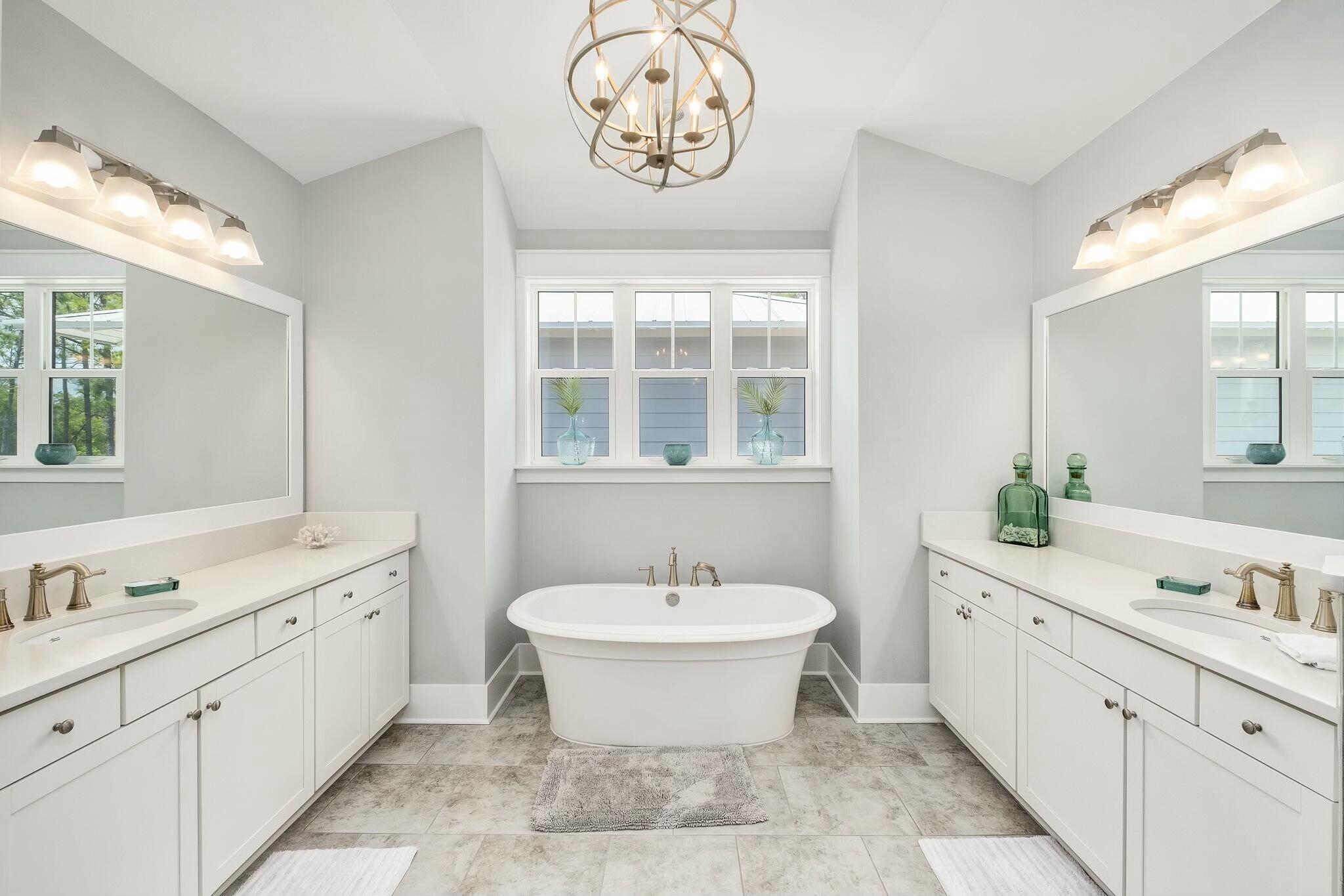 116 Prairie Pass Santa Rosa Beach, FL 32459 - Photo 17 of 59 a spacious bathroom with a double vanity sink a mirror and a bathtub