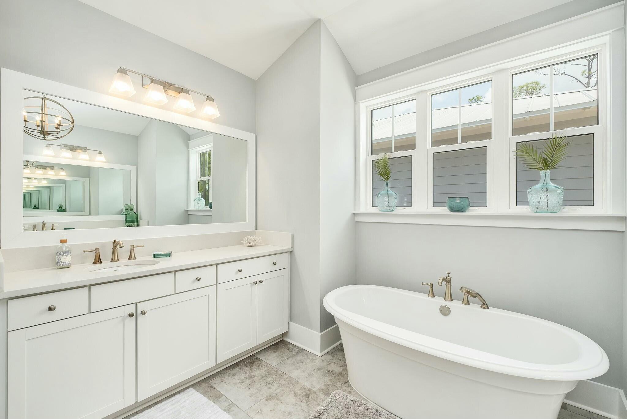 116 Prairie Pass Santa Rosa Beach, FL 32459 - Photo 18 of 59 a bathroom with a double vanity sink a mirror and a bathtub