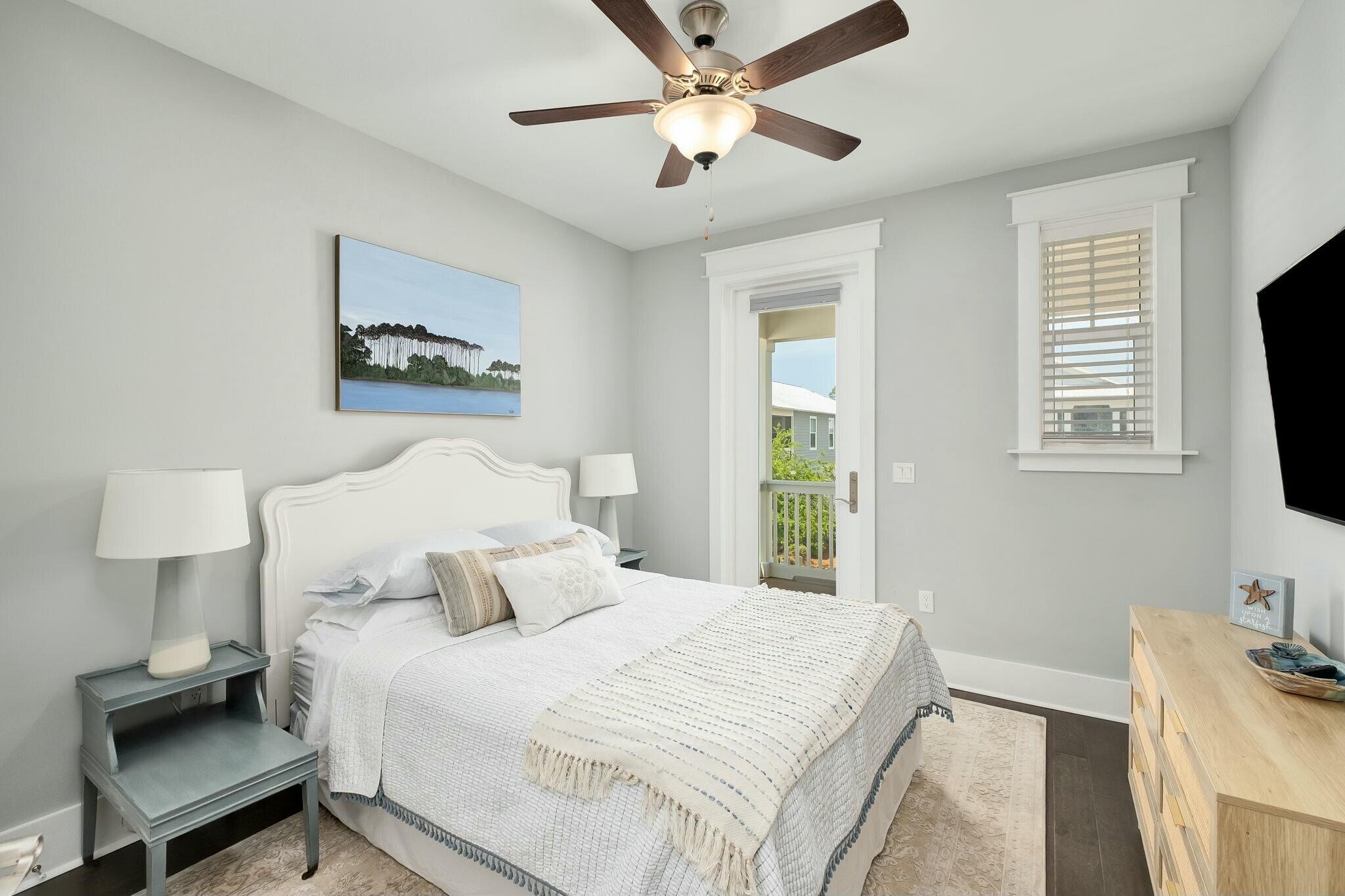 116 Prairie Pass Santa Rosa Beach, FL 32459 - Photo 24 of 59 a bedroom with a bed and a flat screen tv
