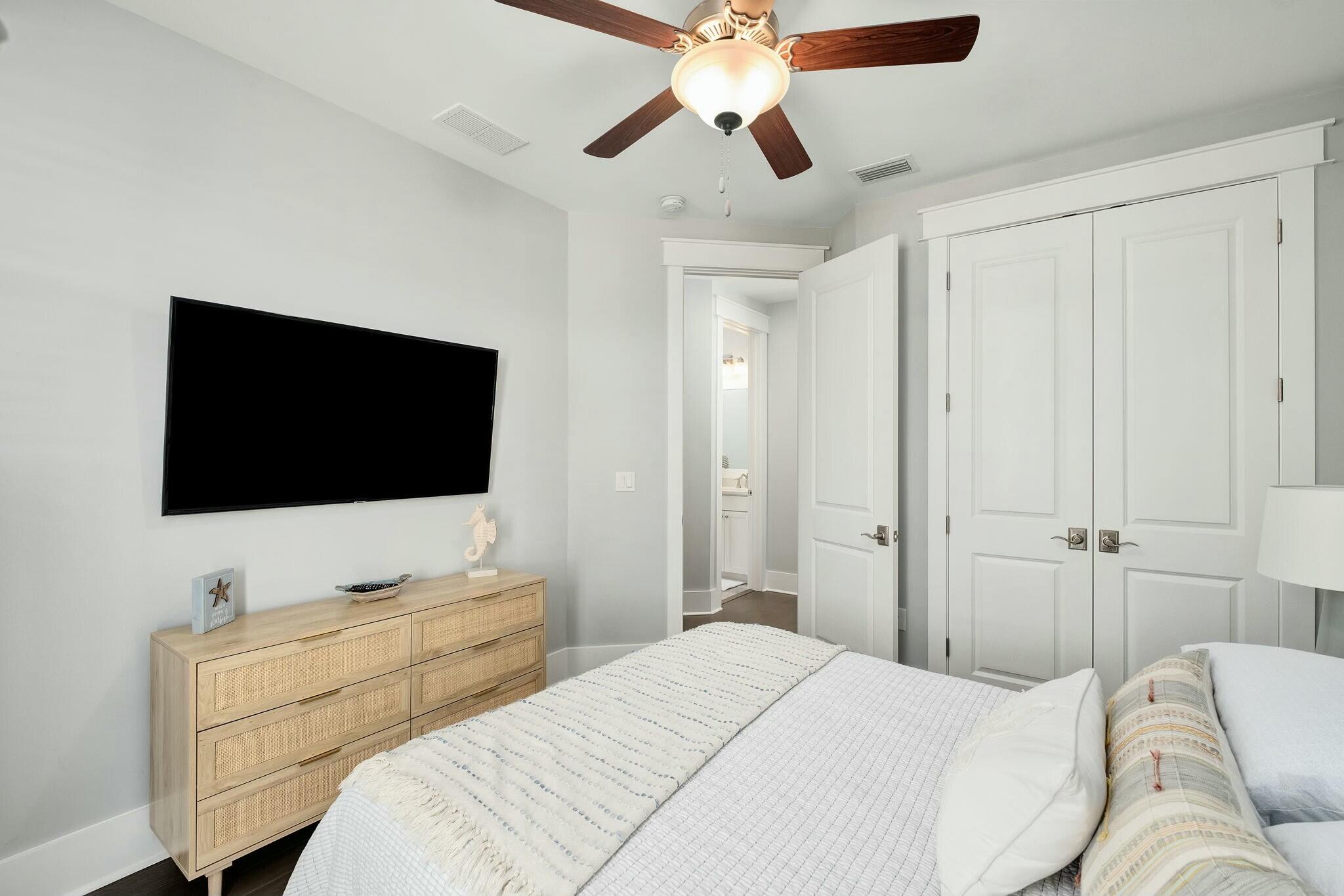 116 Prairie Pass Santa Rosa Beach, FL 32459 - Photo 25 of 59 a bedroom with a bed and a flat screen tv