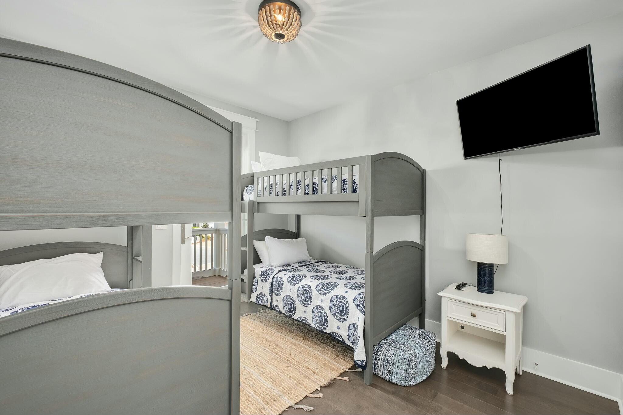 116 Prairie Pass Santa Rosa Beach, FL 32459 - Photo 27 of 59 a bedroom with a bed and a flat screen tv