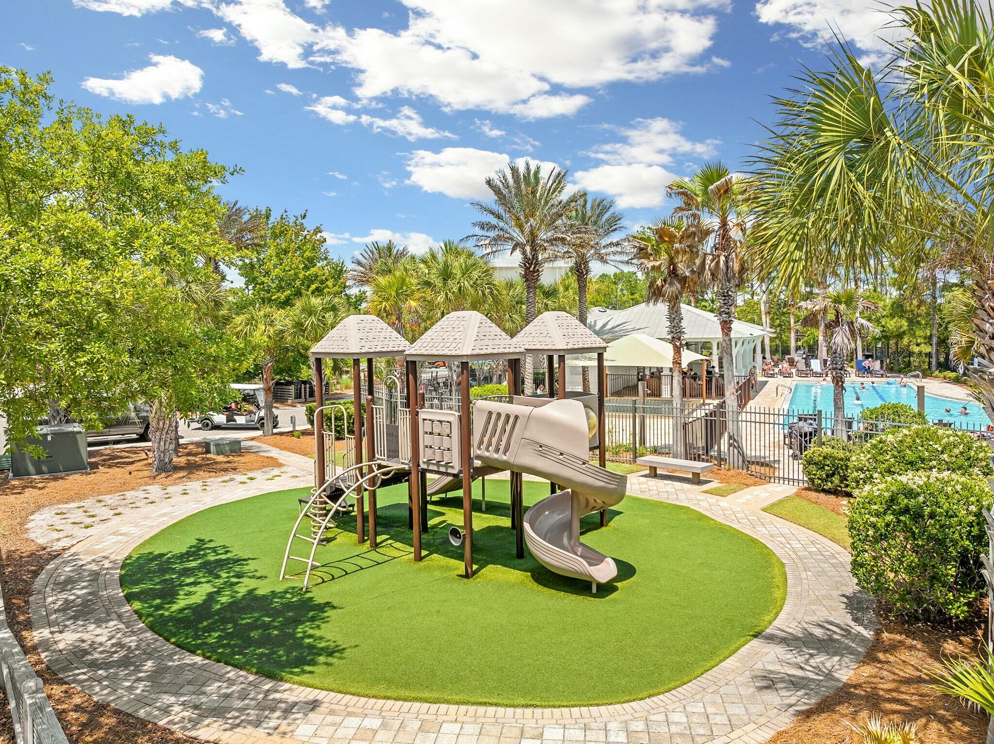 116 Prairie Pass Santa Rosa Beach, FL 32459 - Photo 36 of 59 a swimming pool with outdoor seating and trees