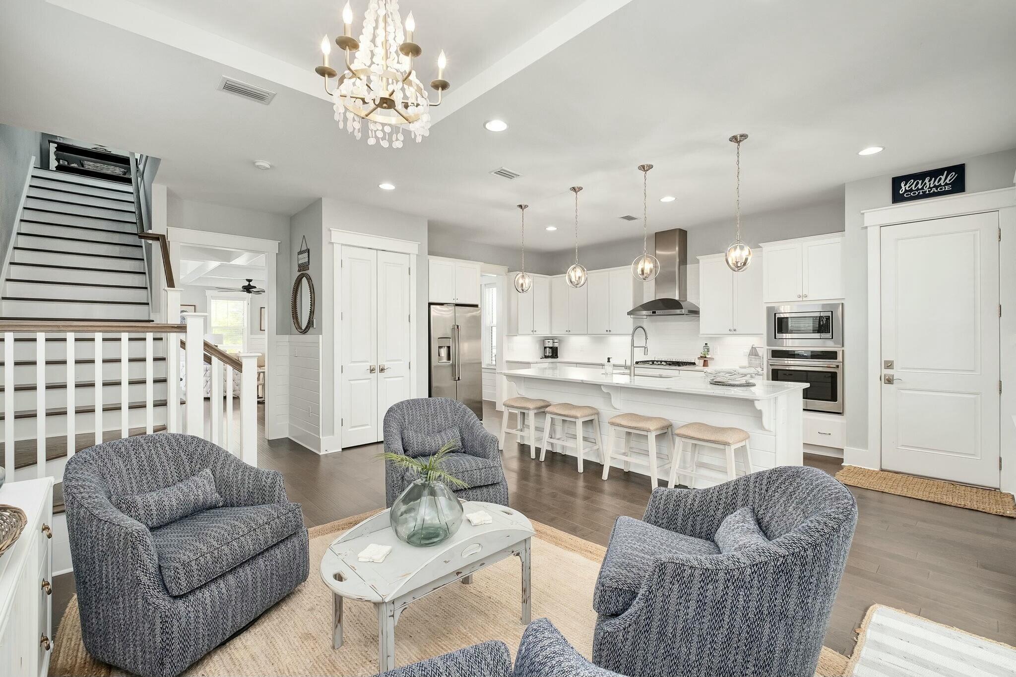 116 Prairie Pass Santa Rosa Beach, FL 32459 - Photo 9 of 59 a living room with furniture kitchen and a chandelier