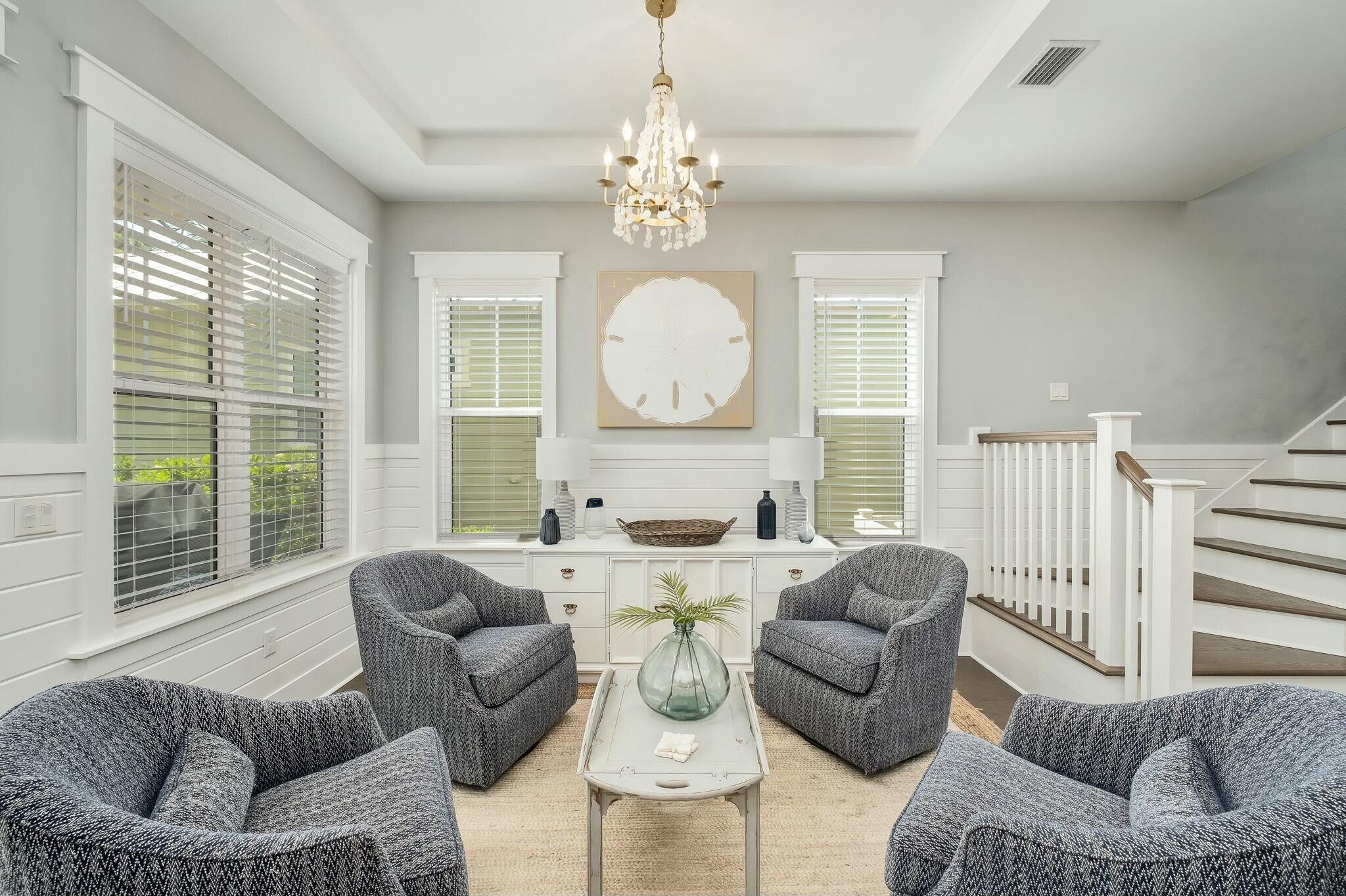 116 Prairie Pass Santa Rosa Beach, FL 32459 - Photo 10 of 59 a living room with furniture large windows and a chandelier