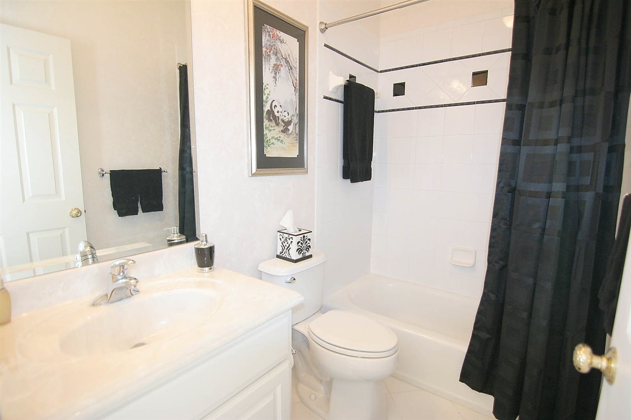 11833 Lowery Ridge Drive Raleigh, NC 27614 - Photo 18 of 25 Custom Shower Tile work in all four bathrooms as well as upgraded marble vanities in all baths. This bathroom is attached to a guest room which can be used as a "2nd master" and perfect for guests. Guest Bath