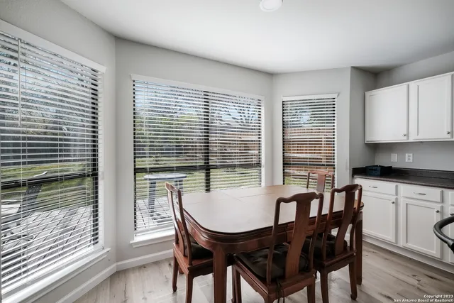 a view of a dining room with furniture and window