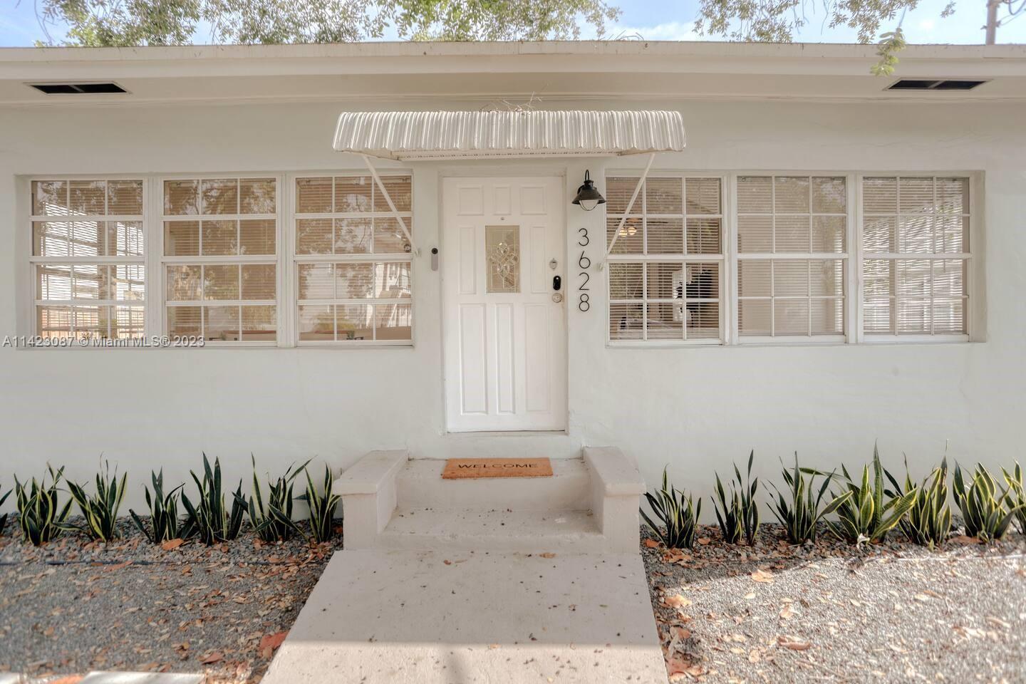 3628 Thomas Avenue Miami, FL 33133 - Photo 1 of 24 a front view of a house