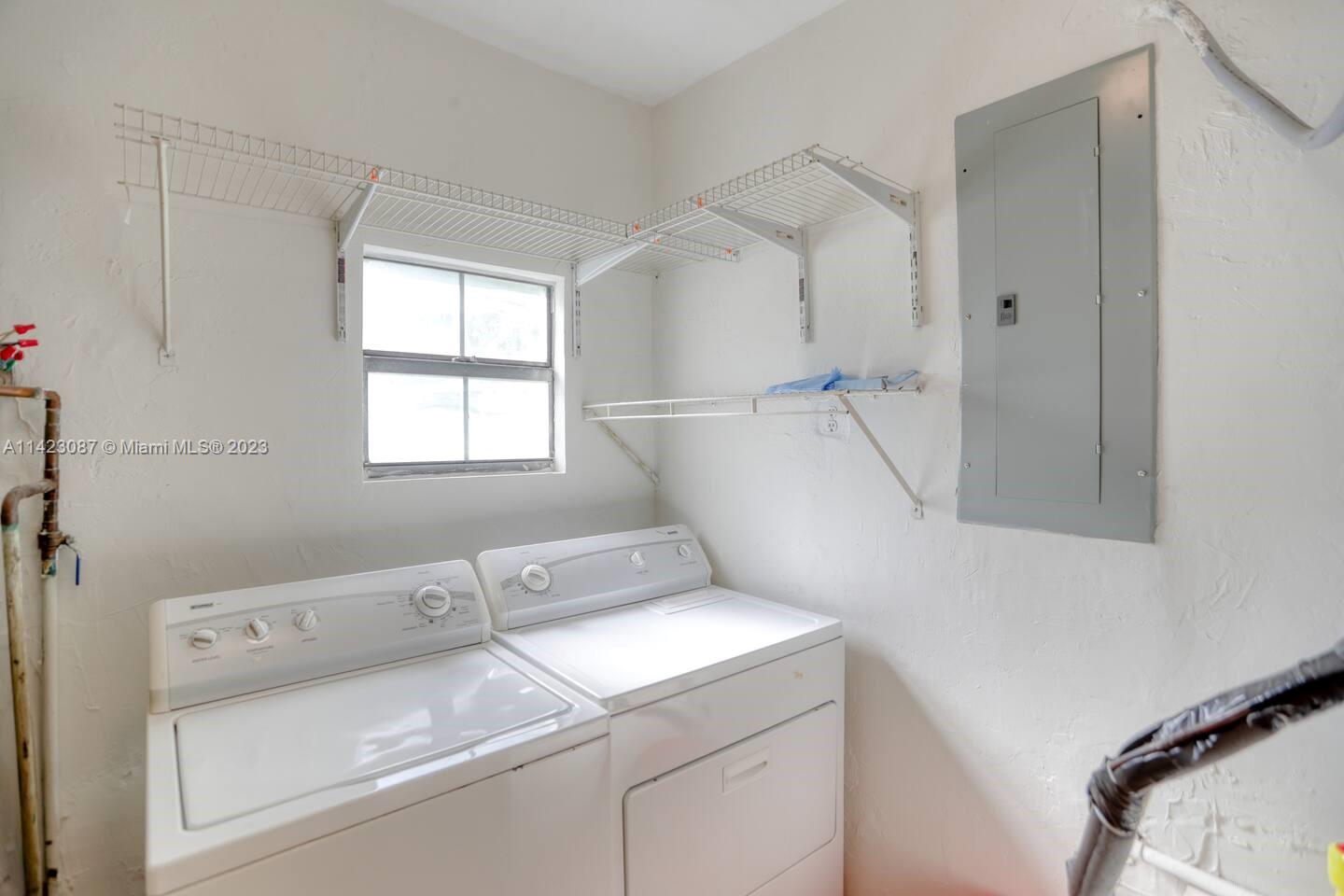 3628 Thomas Avenue Miami, FL 33133 - Photo 16 of 24 a utility room with dryer and washer