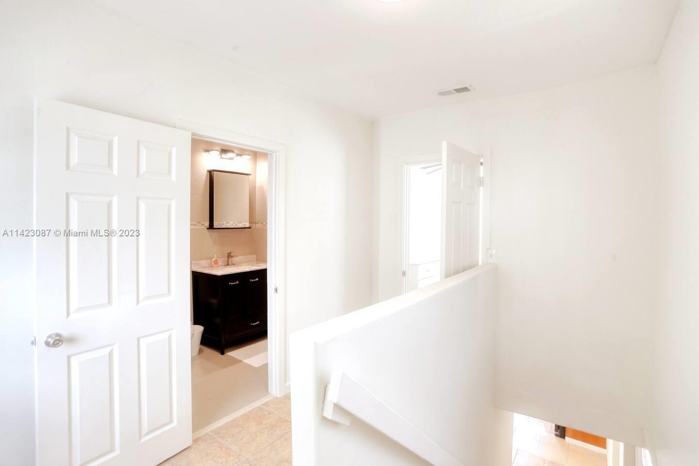 3628 Thomas Avenue Miami, FL 33133 - Photo 18 of 24 a view of a bathroom with a sink