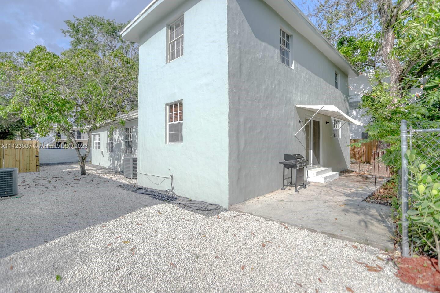 3628 Thomas Avenue Miami, FL 33133 - Photo 24 of 24 a house view with a backyard space