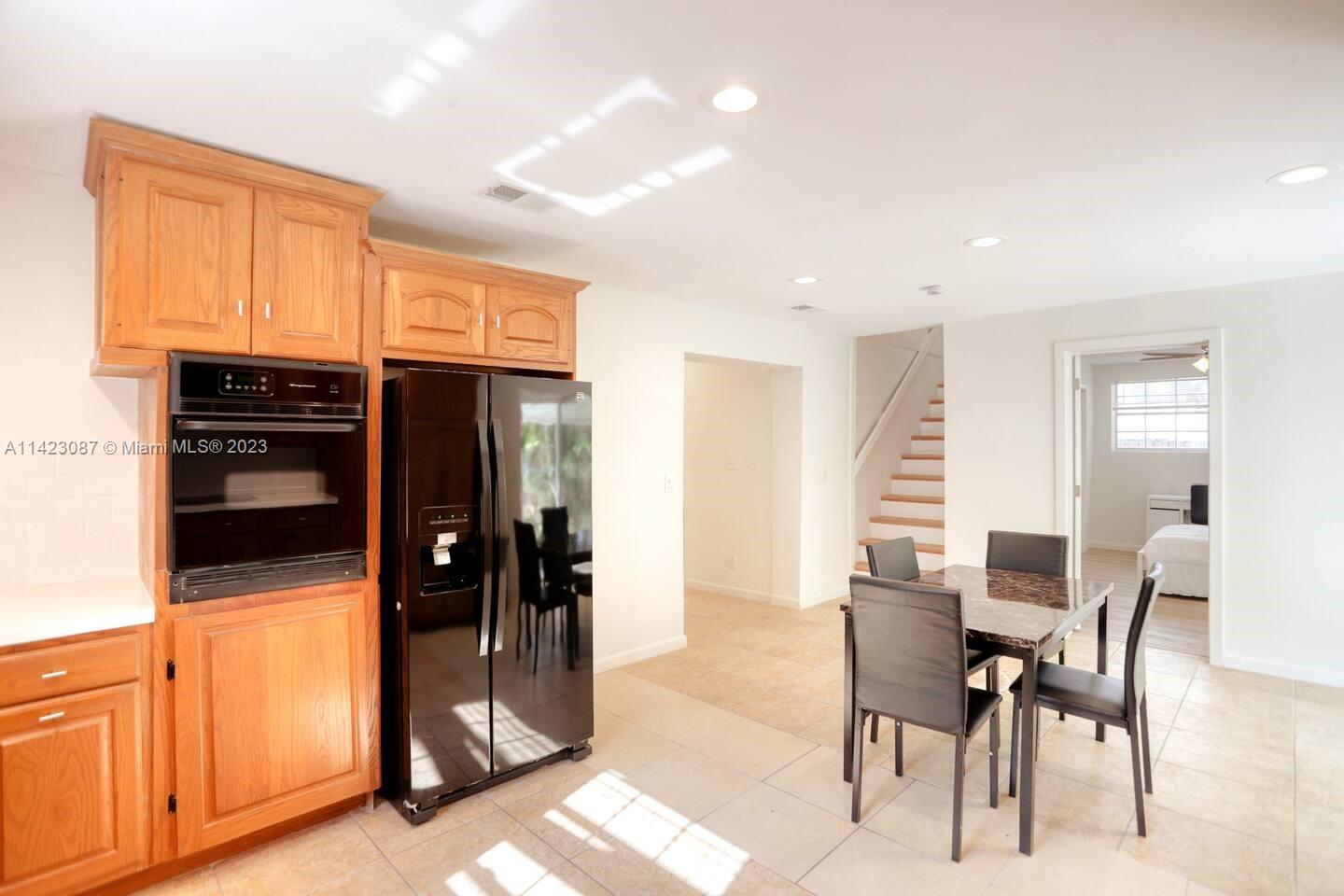 3628 Thomas Avenue Miami, FL 33133 - Photo 7 of 24 a view of dining area with chandelier