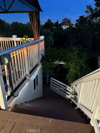 a view of a balcony with two chairs