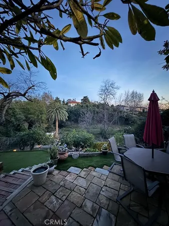 a view of a backyard with sitting area