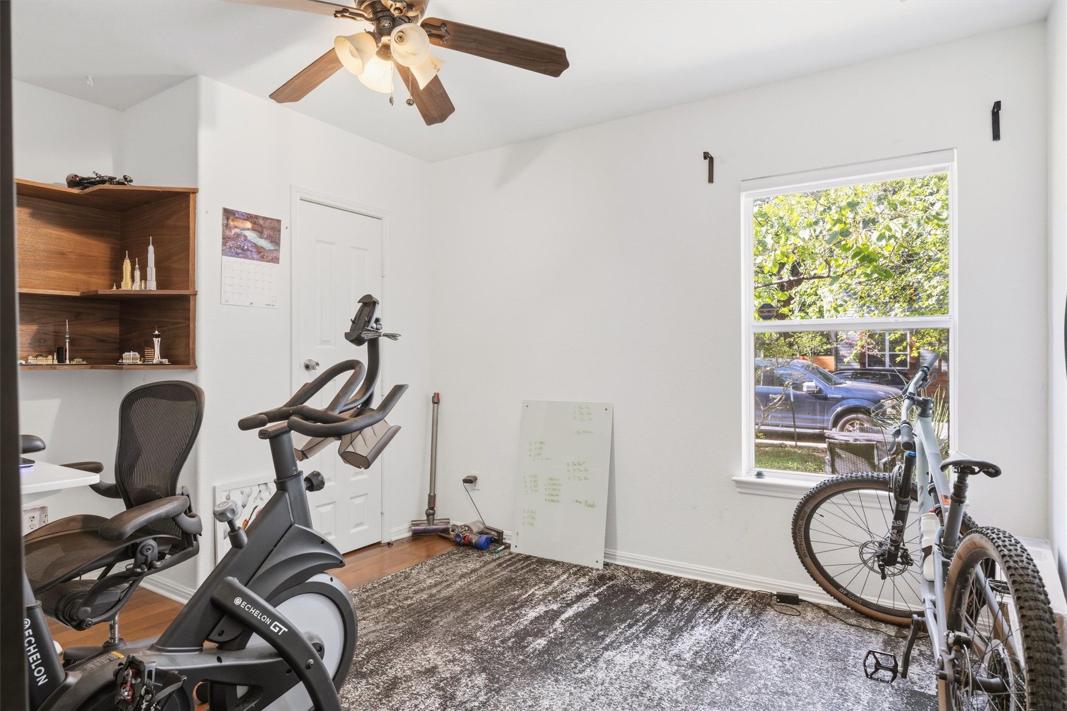 3015 Castro Street Austin, TX 78702 - Photo 15 of 40 A versatile space ready for a home office or fitness setup, illuminated by a large window.