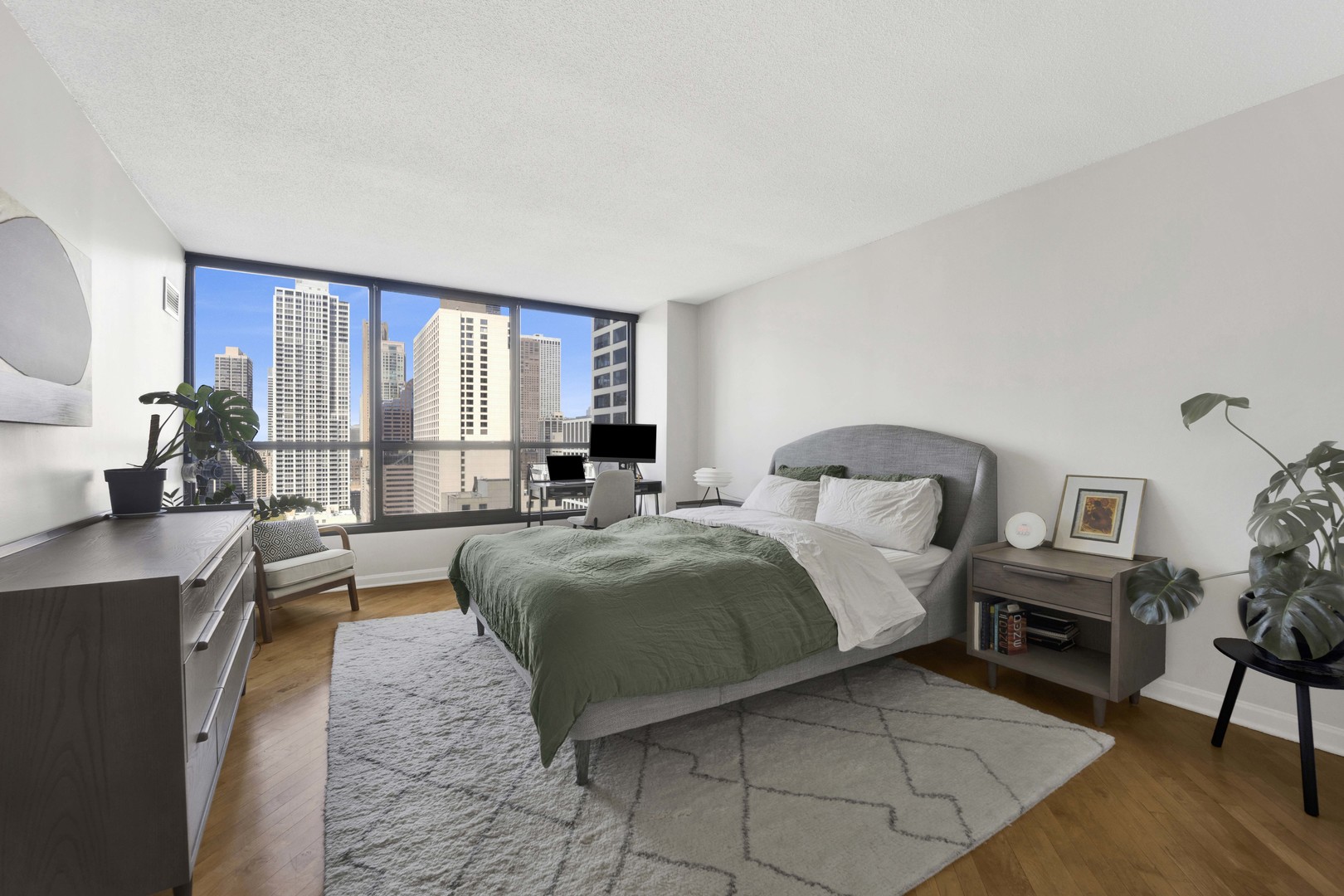 405 North Wabash Avenue, Unit 2614 Chicago, IL 60611 - Photo 6 of 22 a spacious bedroom with a large bed and a window