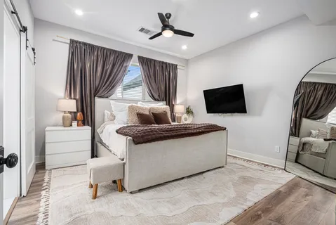 a living room with fireplace furniture and a flat screen tv